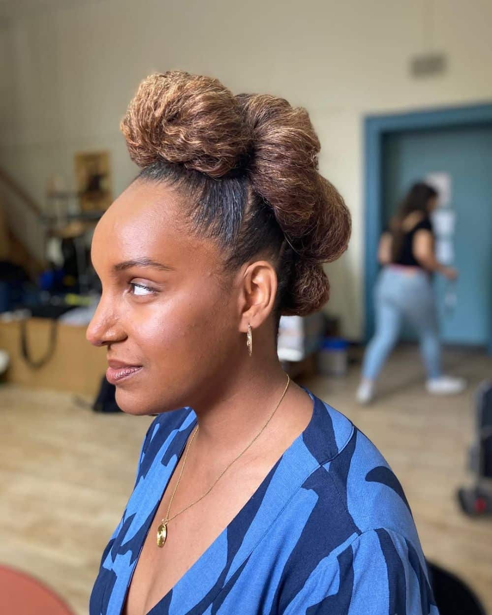 1. Textured High Bun with Side Volume