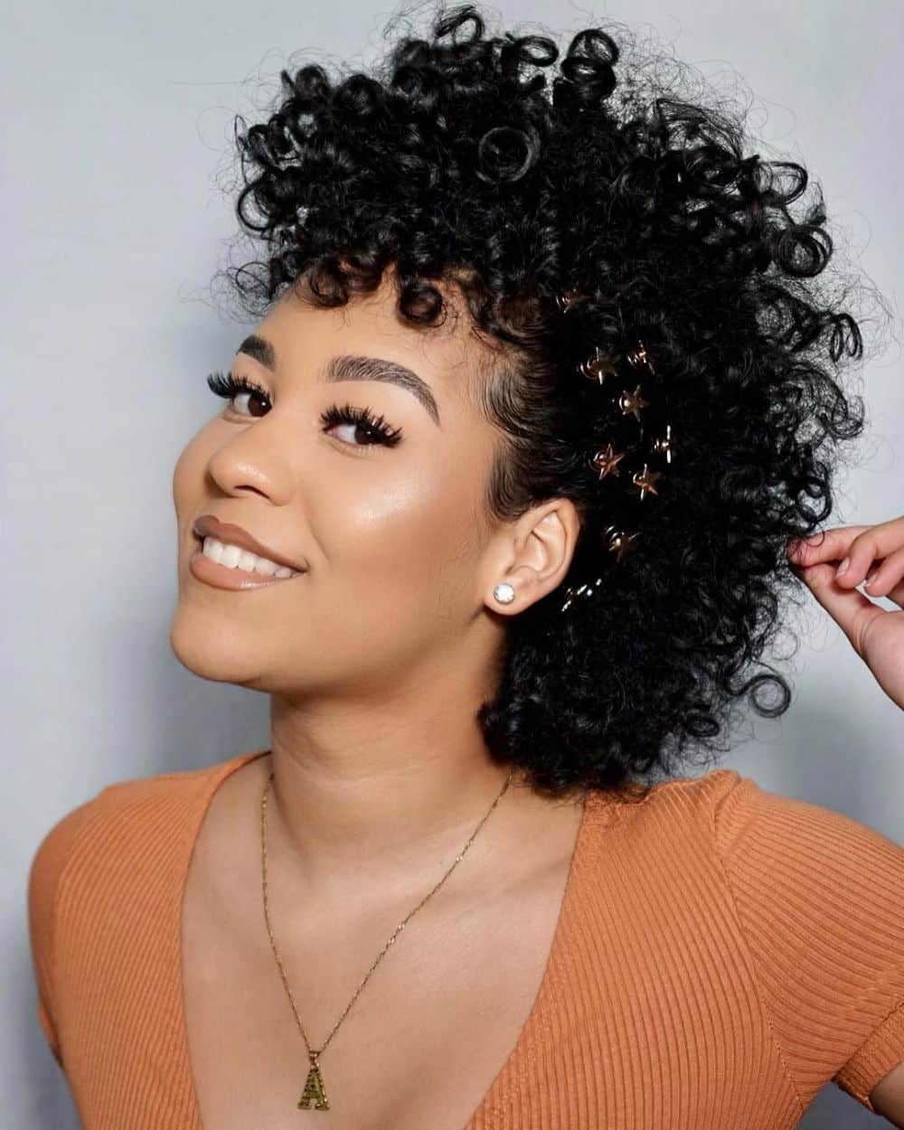 2. Voluminous Curly Choppy Bob with Hair Accessories