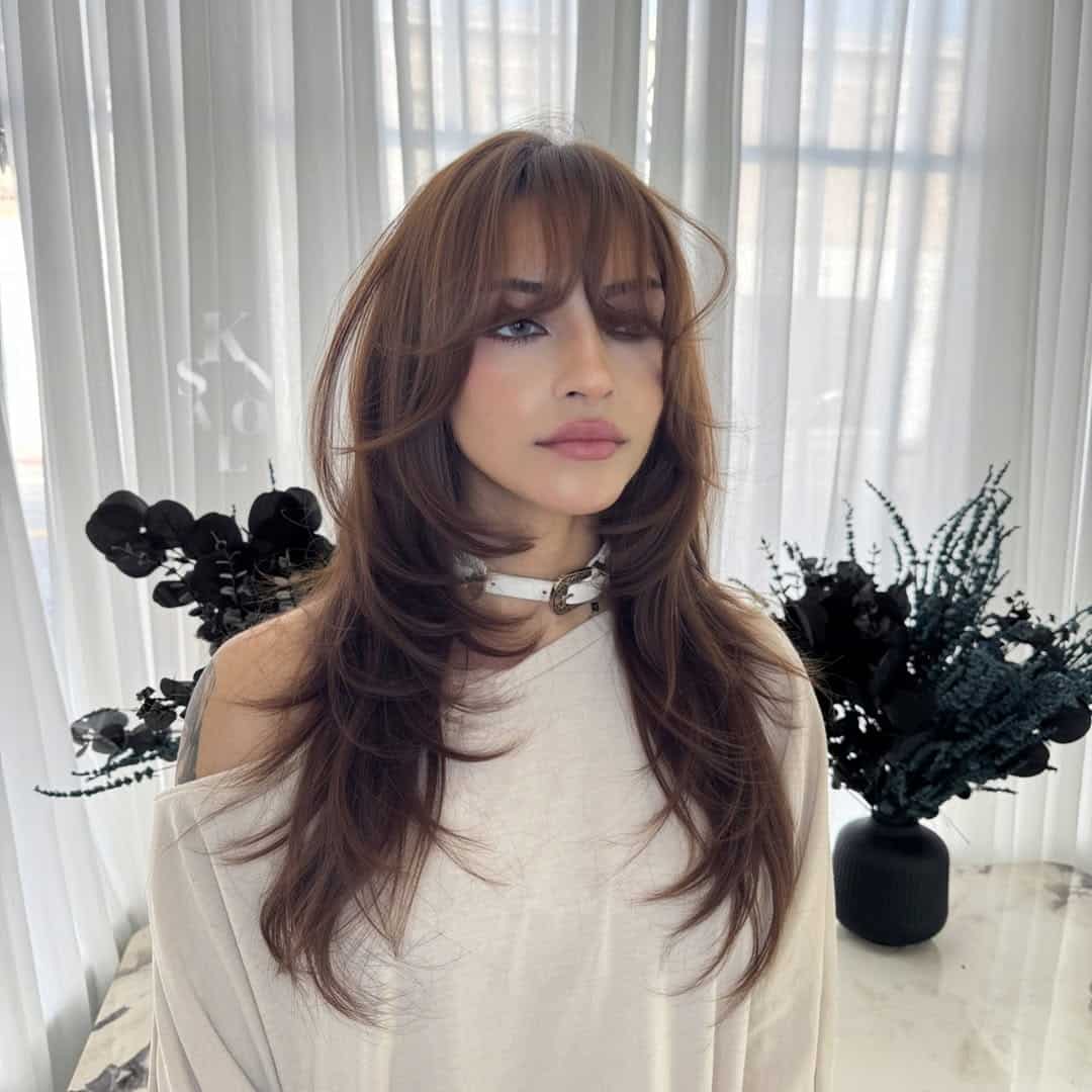 13. Airy Curtain Bangs with Swoopy Layers