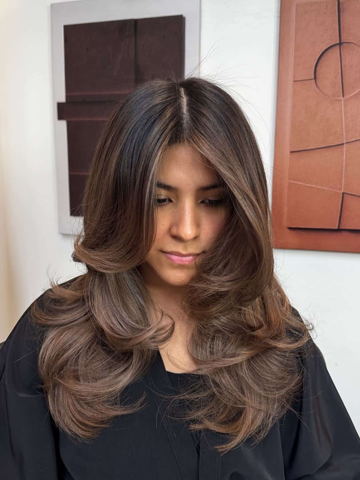 6. Big Blowout Layers with Wispy Curtain Bangs