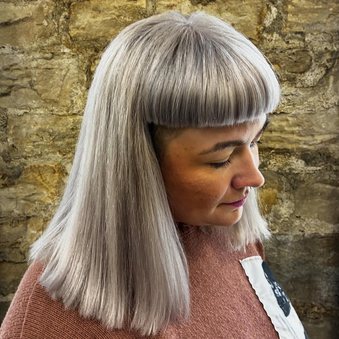 16. Blunt Micro Bangs with Sleek Silver Length