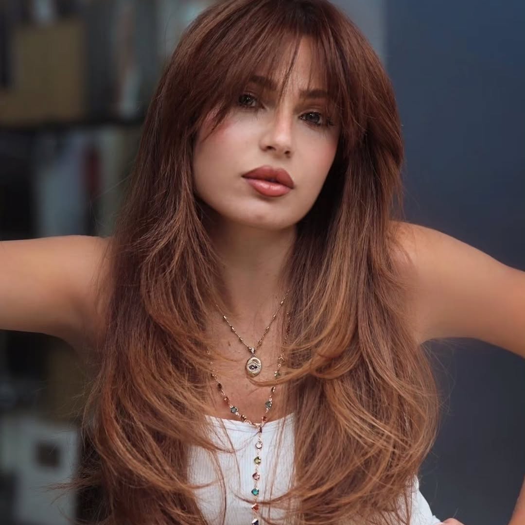 20. Cinnamon Layers with Soft Bardot Bangs