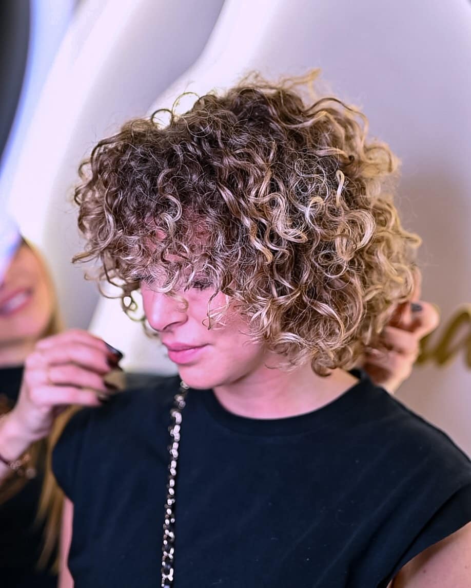 4. Curly Bob Haircut with Face-Framing Layers
