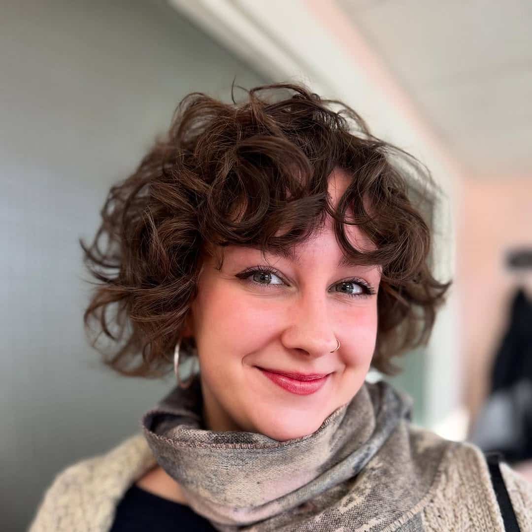 3. Curly Bob with Textured Bangs