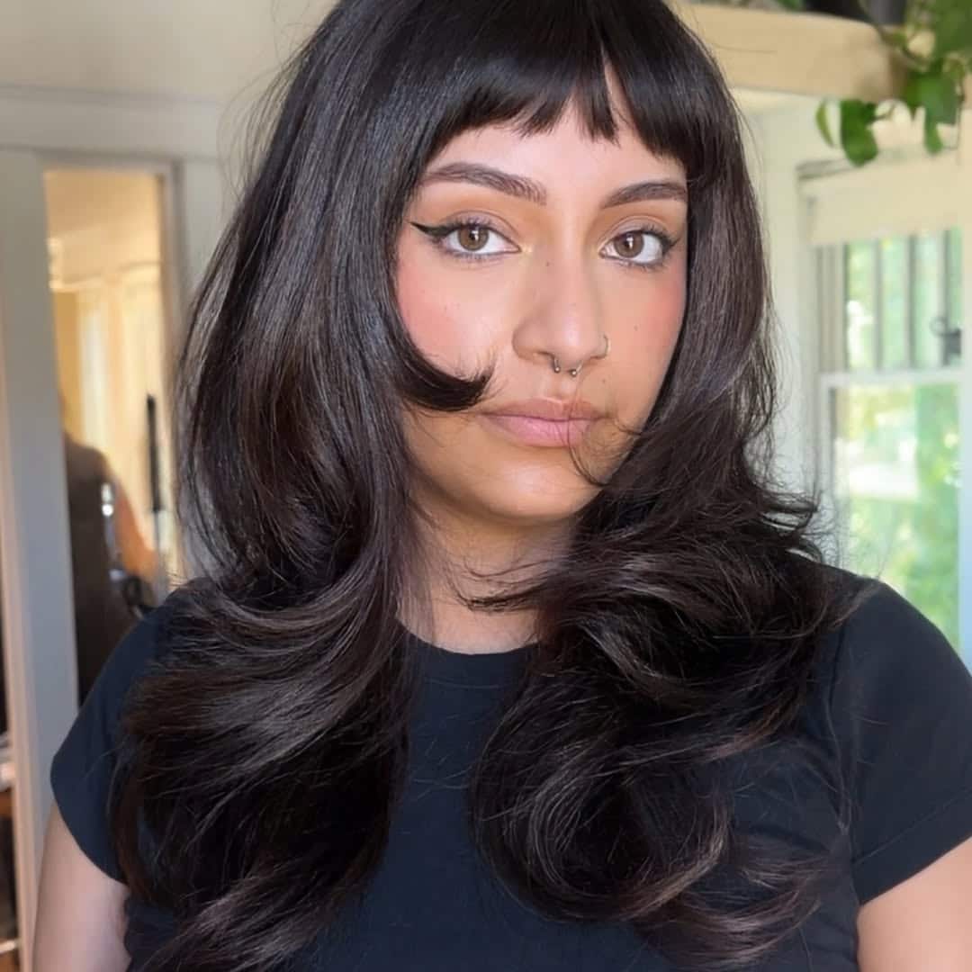 17. Flirty Layered Volume with Micro Bangs