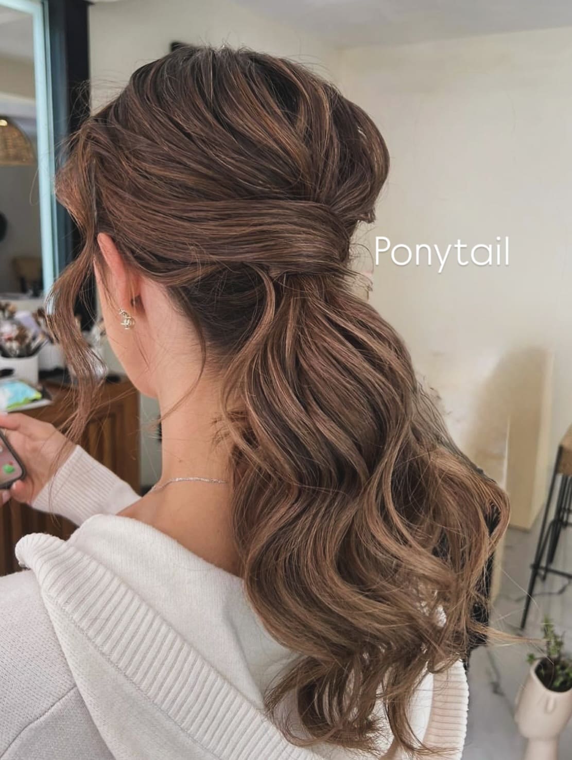 4. Loose Wrapped Ponytail with Soft Waves