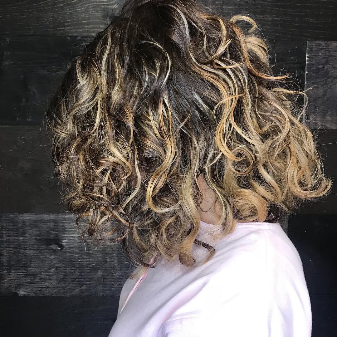 4. Playful Layered Curly Bob