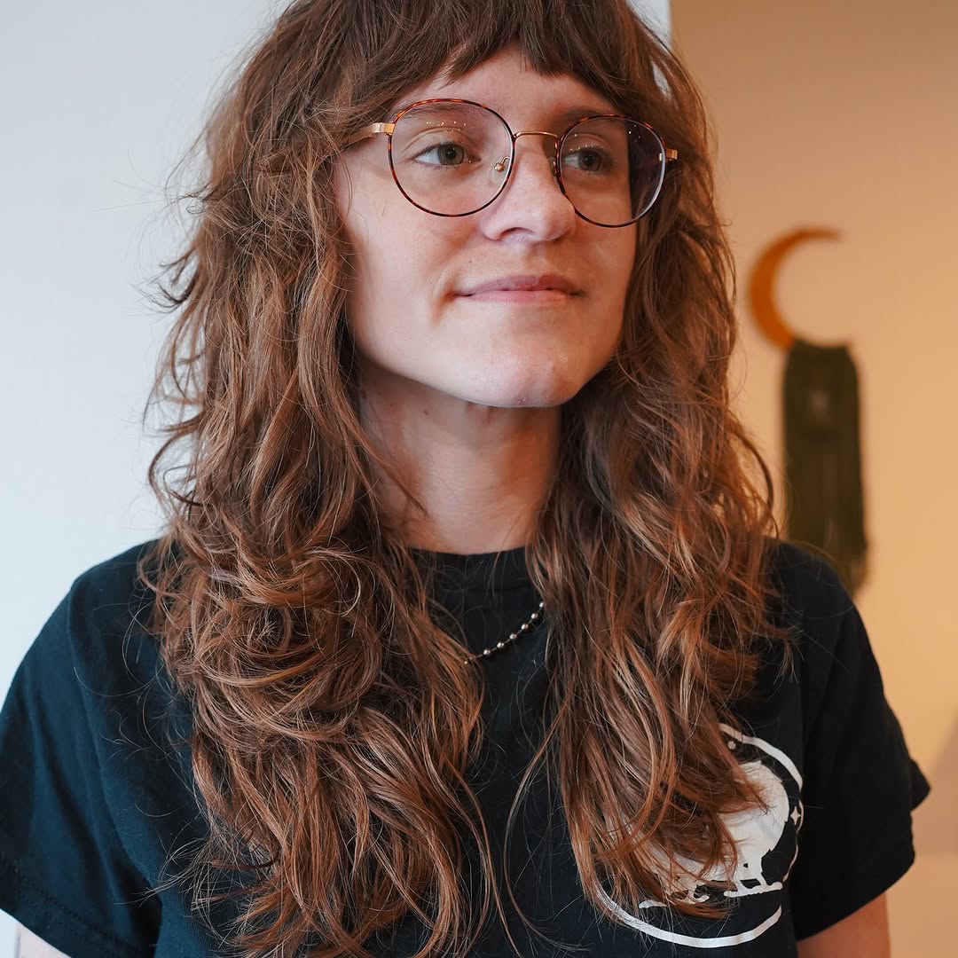 5. Shaggy Layers with Blunt Bangs