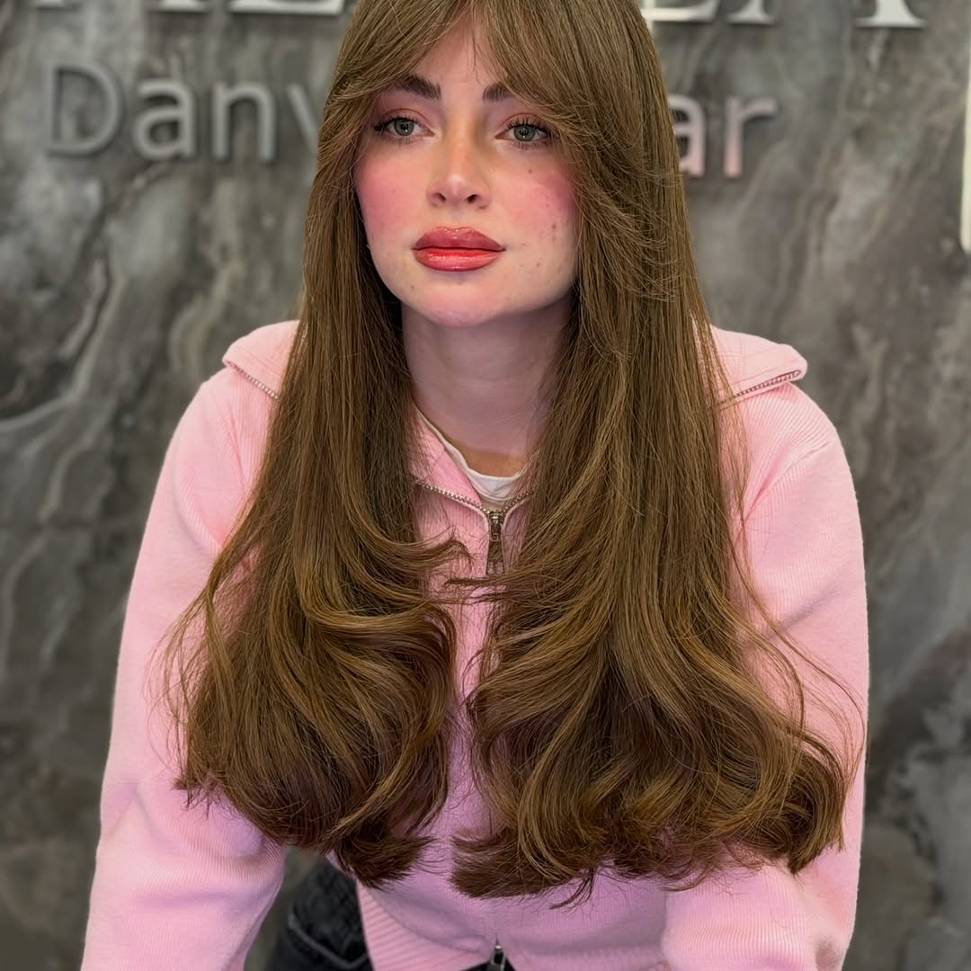 26. Soft Layers with Curtain Bangs and Luxe Volume