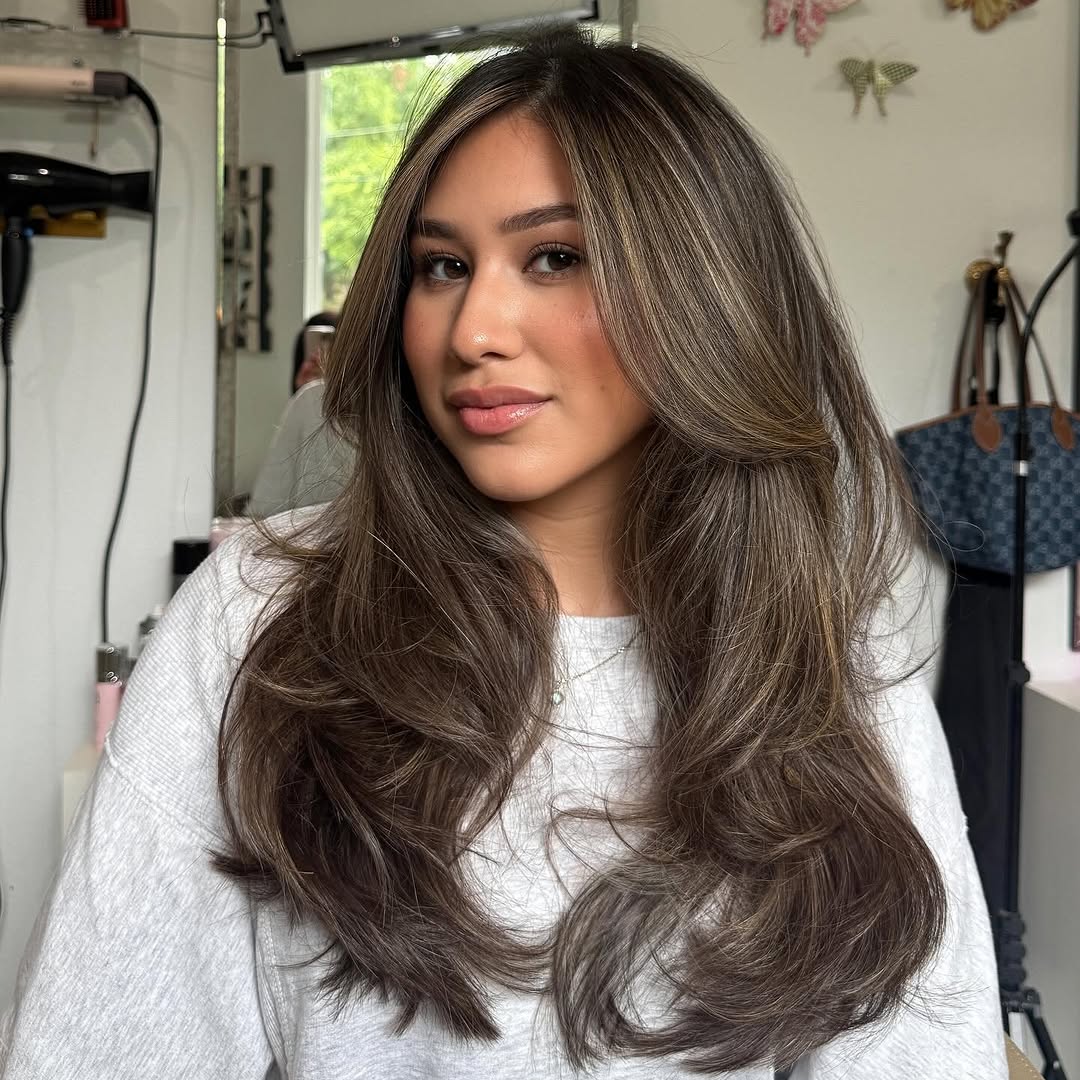 24. Soft Layers with Curtain Bangs