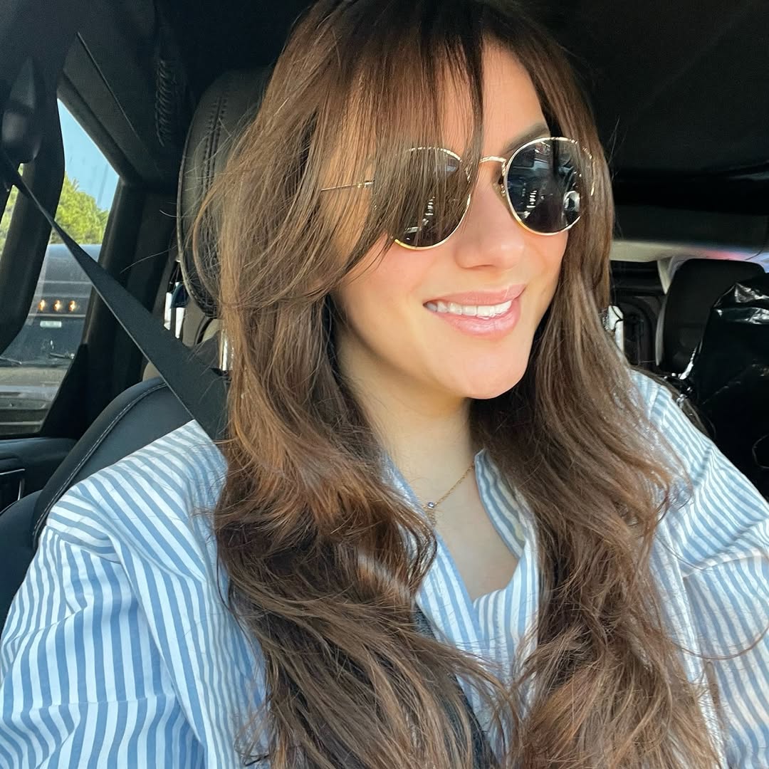 11. Sun-Kissed Waves with Wispy Bangs