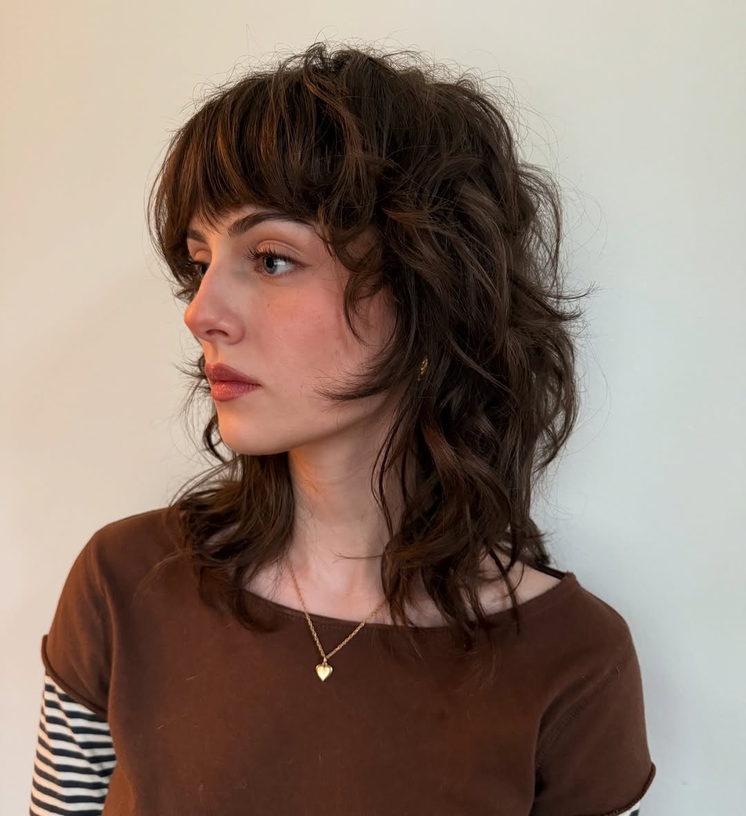 3. Textured Shag with Wispy Bangs