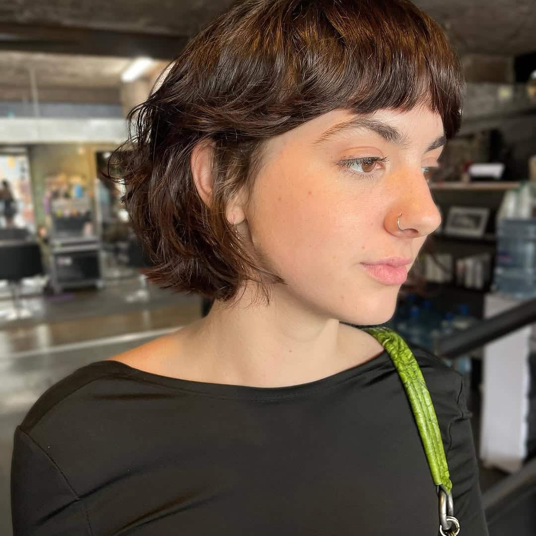3. Textured Shaggy Curly Bob with Micro Bangs
