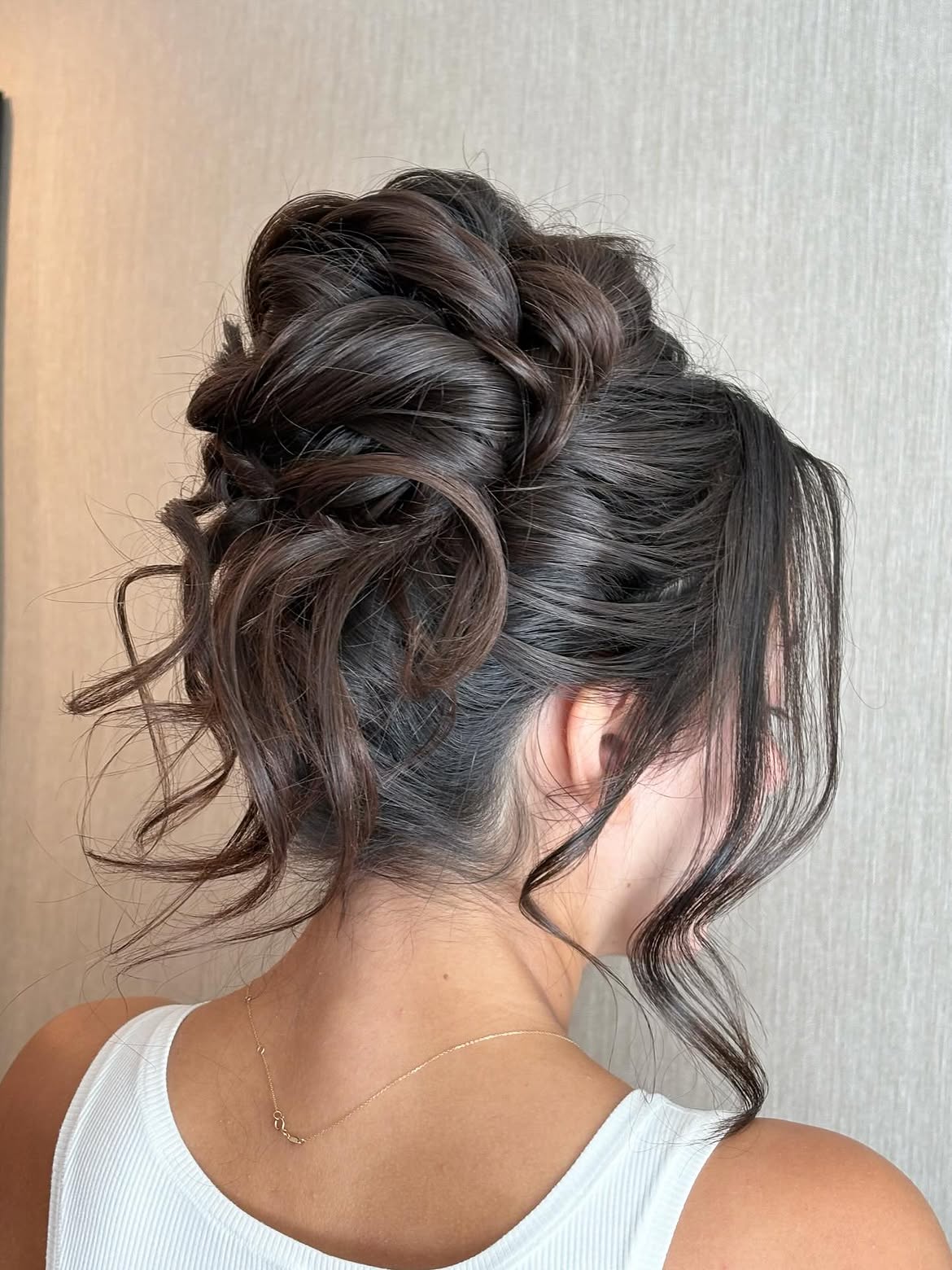 4. Twisted Romantic Updo with Face-Framing Tendrils