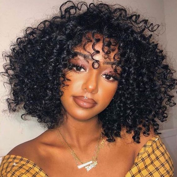 18. Voluminous Curls with a Deep Side Part