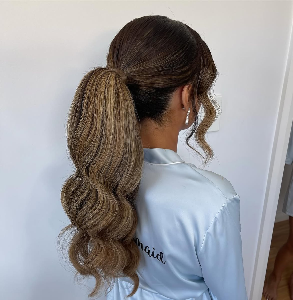 2. Voluminous Waves Ponytail