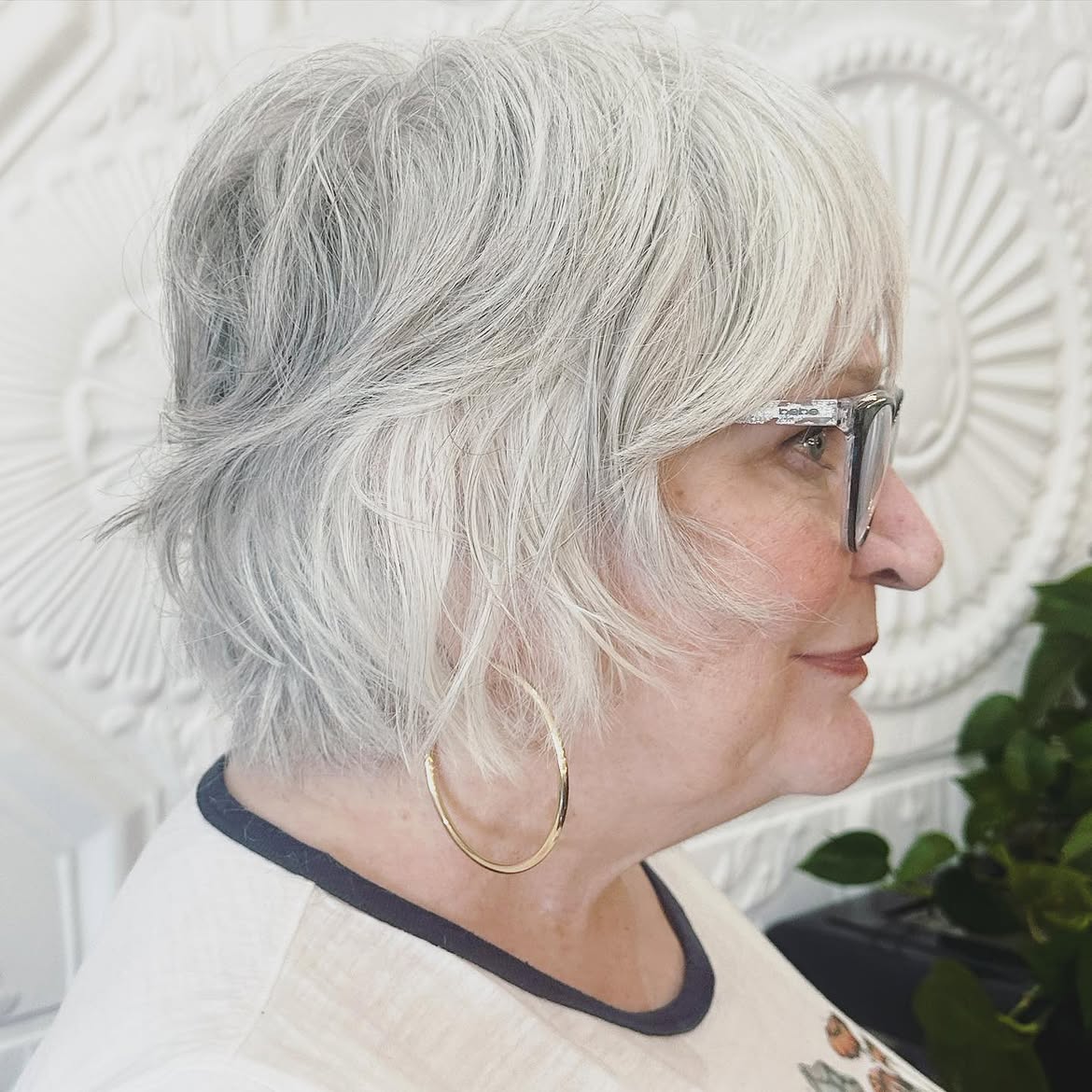 2. Wispy Silver Layers with Side Bangs